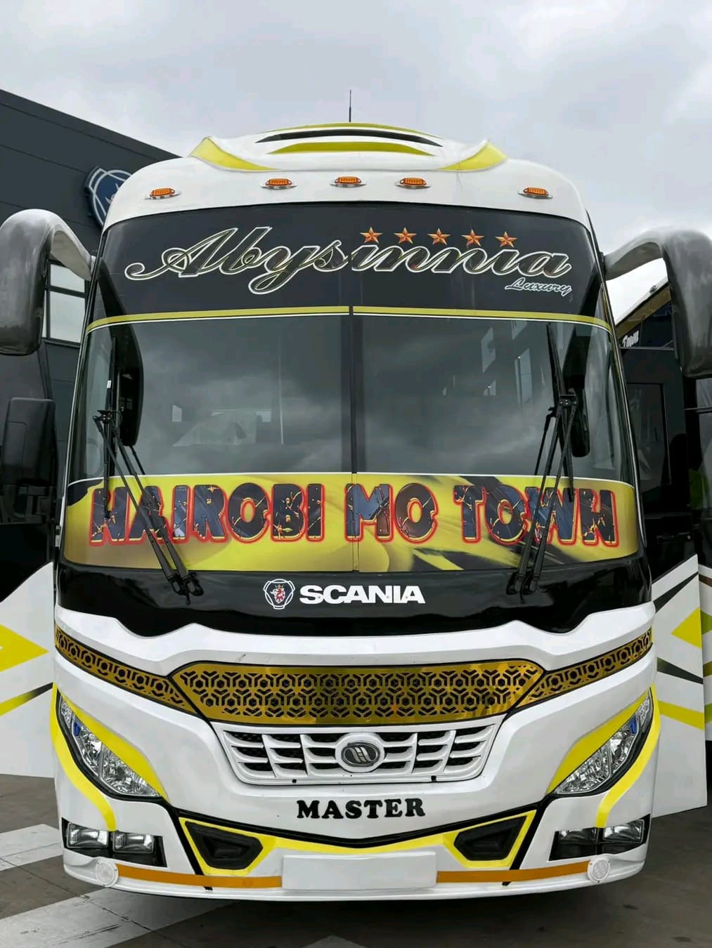 Close-up of the Abyssinia Luxury Coach front grille and windscreen branding