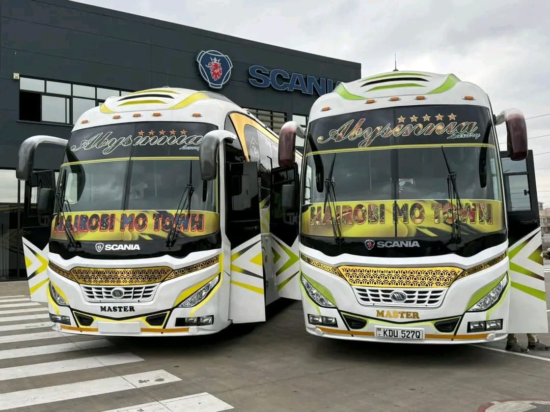 Two Abyssinia Luxury Coach Scania buses parked side by side outside the Scania dealership